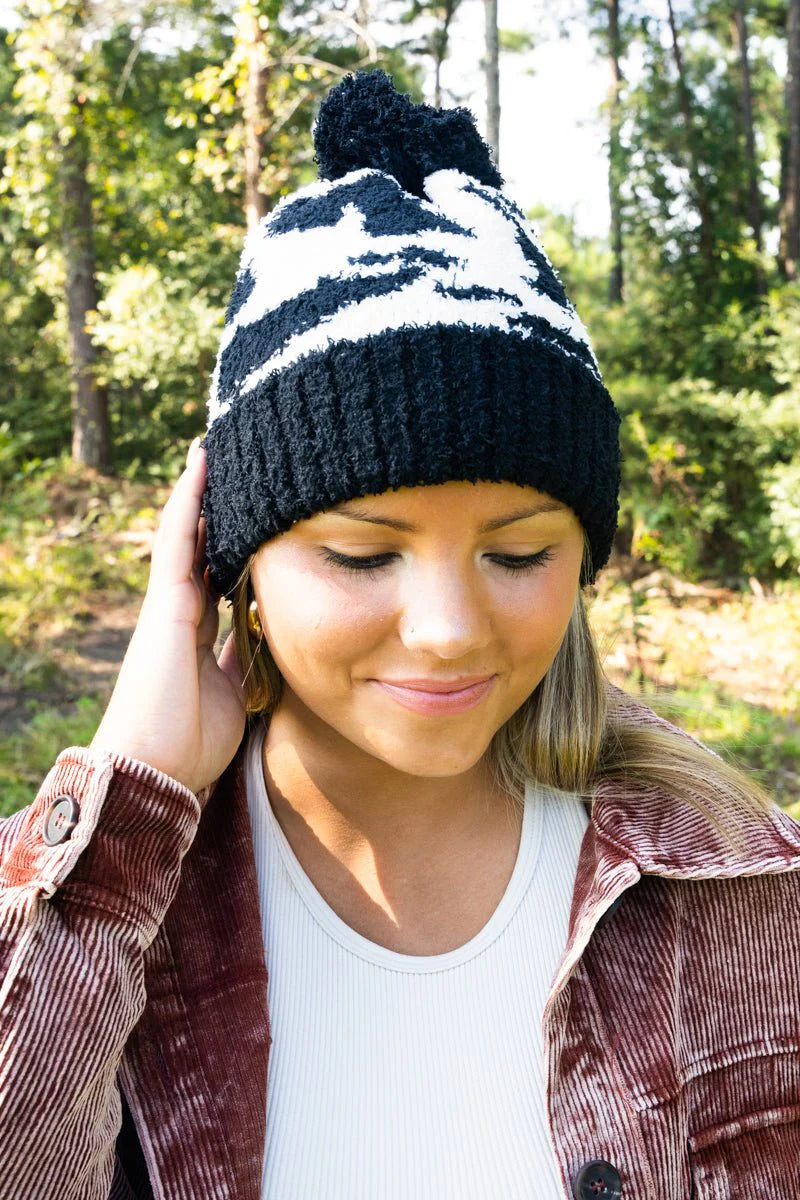 COZY CUDDLES DOMINO COW POM POM BEANIE